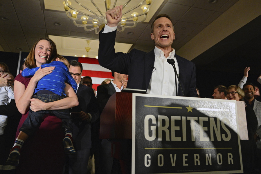 FILE - Missouri Republican Governor-elect Eric Greitens delivers a victory speech along side his wife Sheena and son Joshua on Tuesday, Nov. 8, 2016, in Chesterfield, Mo. The judge in the child custody case involving the former Missouri governor ruled that it should move to Texas because his two sons now spend most of their time there, and to better protect the boys from public scrutiny, according to a court document obtained Thursday, Sept. 8, 2022, by The Associated Press.