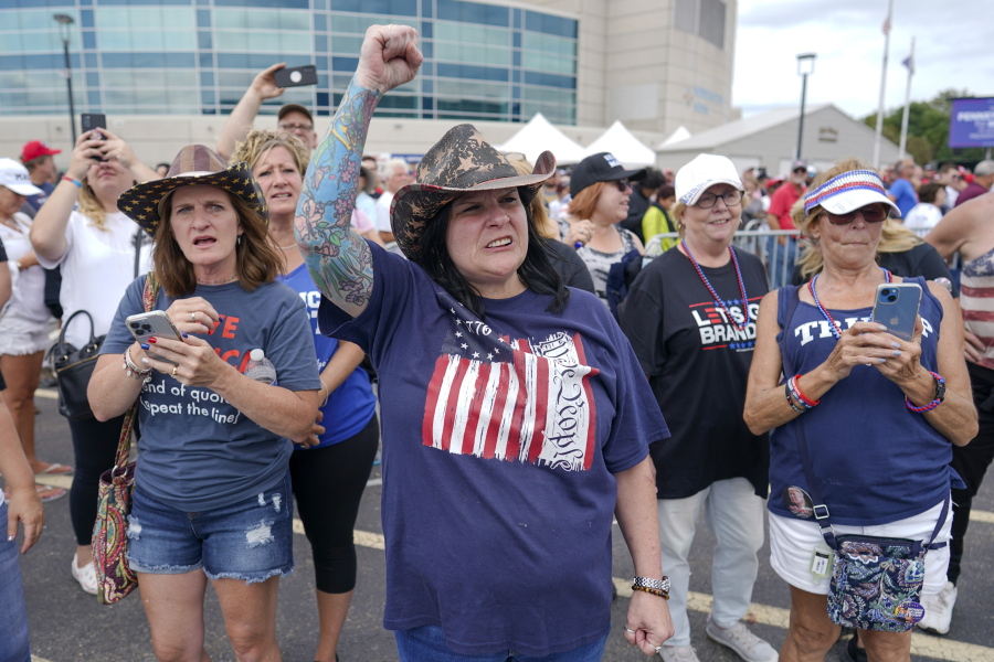 Supporters of former President Donald Trump cheer as they wait in line outside a political rally in Wilkes-Barre, Pa., Saturday, Sept. 3, 2022.