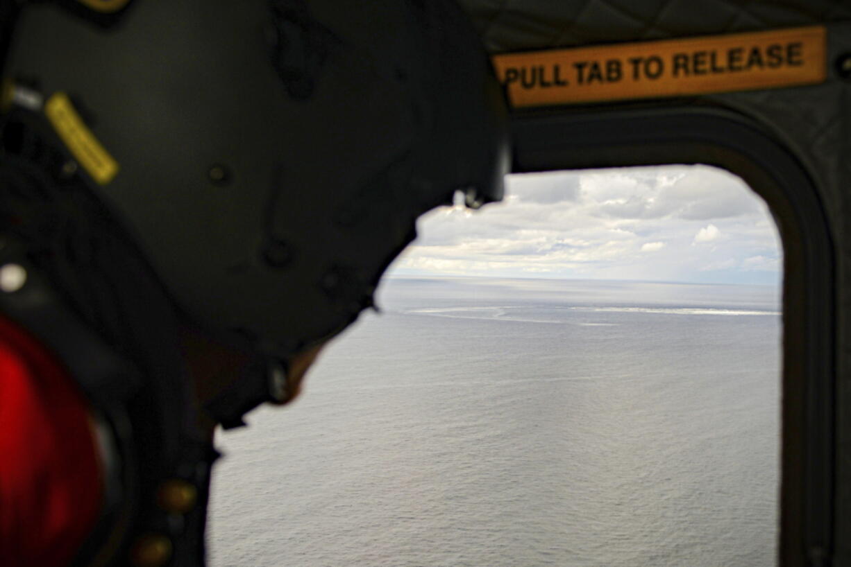 In this photo provided by the Armed Forces of Denmark, the crew in a helicopter of the Armed Forces monitors the gas leak, in the Baltic Sea, Thursday, Sept. 29, 2022. Following the suspected sabotage this week of the Nord Stream 1 and 2 pipelines that carry Russian natural gas to Europe, there were two leaks off Sweden, including a large one above North Stream 1, and a smaller one above North Stream 2.