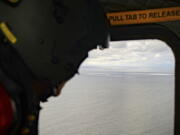 In this photo provided by the Armed Forces of Denmark, the crew in a helicopter of the Armed Forces monitors the gas leak, in the Baltic Sea, Thursday, Sept. 29, 2022. Following the suspected sabotage this week of the Nord Stream 1 and 2 pipelines that carry Russian natural gas to Europe, there were two leaks off Sweden, including a large one above North Stream 1, and a smaller one above North Stream 2.
