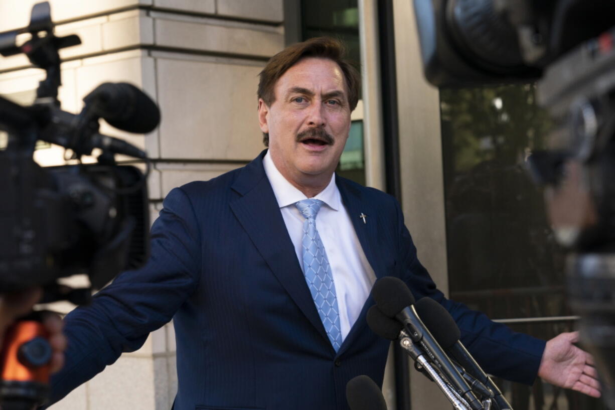 FILE - MyPillow chief executive Mike Lindell speaks to reporters outside federal court in Washington, Thursday, June 24, 2021. On Tuesday, Sept. 13, 2022, Lindell said that federal agents seized his cellphone and questioned him about a Colorado clerk who has been charged in what prosecutors say was a "deceptive scheme" to breach voting system technology used across the country.
