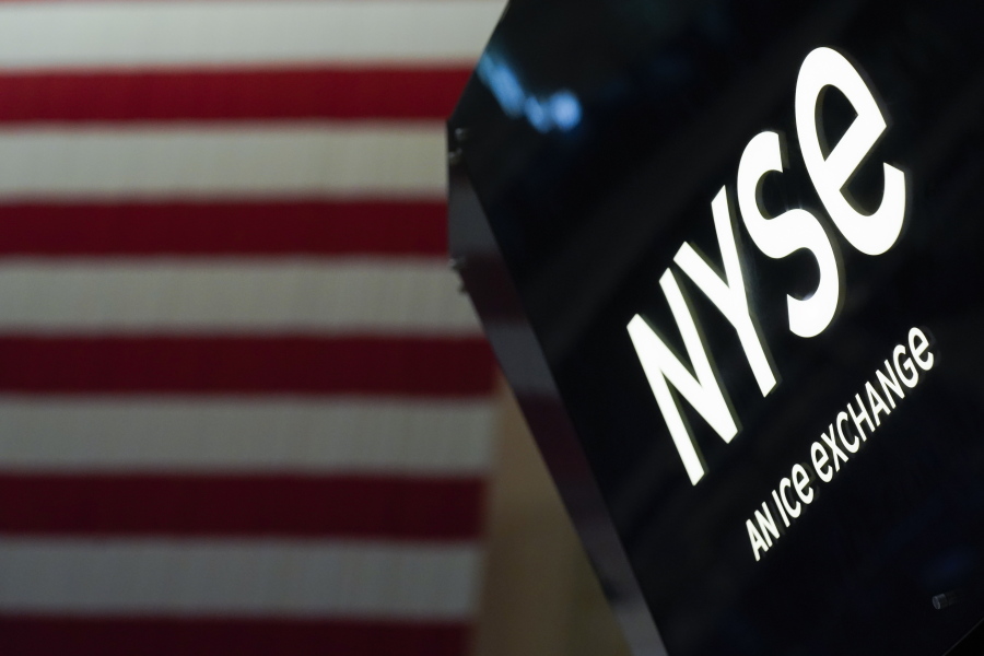 FILE - An NYSE sign is seen on the floor at the New York Stock Exchange in New York, on June 15, 2022. Stocks are tumbling and disappointment is hitting markets worldwide Tuesday, Sept. 13, 2022 following Wall Street's sudden realization that inflation isn't slowing as much as hoped.