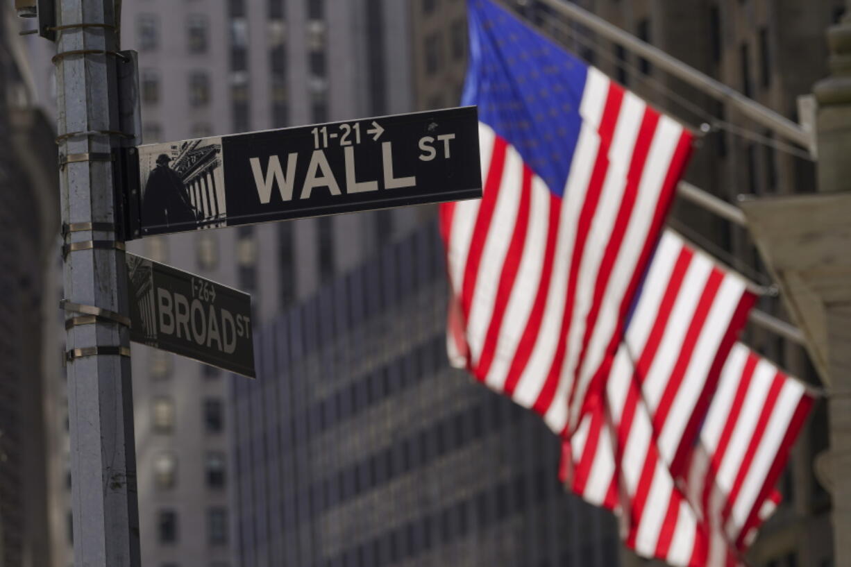 American flags fly outside the New York Stock Exchange, Friday, Sept. 23, 2022, in New York. Stocks tumbled worldwide Friday on more signs the global economy is weakening, just as central banks raise the pressure even more with additional interest rate hikes.