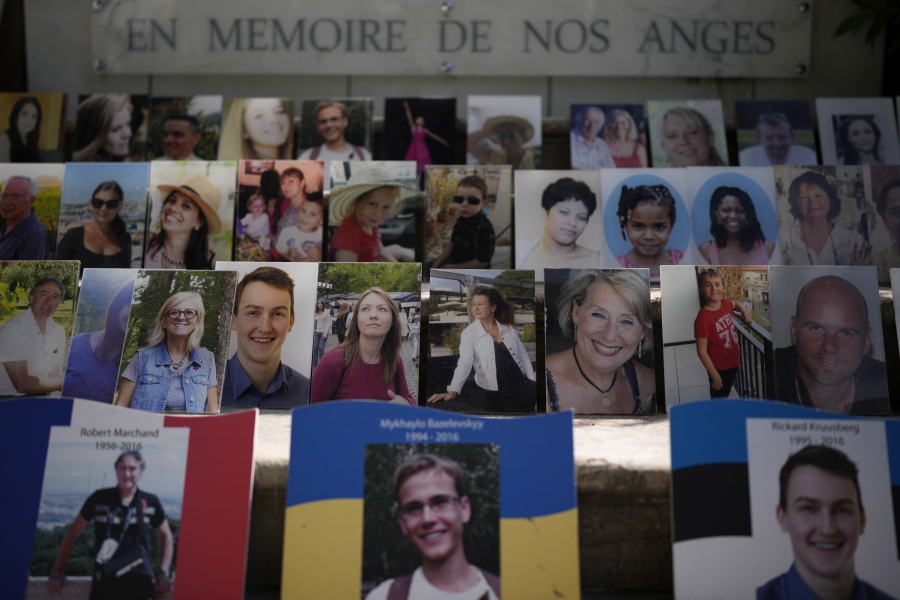 "In Memory of our Angels" is engraved on the on the memorial of the victims of the attack of July 14, 2016 with pictures of the victims along Nice's Promenade des Anglais, to commemorate the 2016 terror attack, in Nice, South of France, Sunday, Sept. 4, 2022. Eight suspects will face trial in a Paris Court on Monday, in connection with the 2016 Bastille Day truck attack in Nice that left 86 people dead.