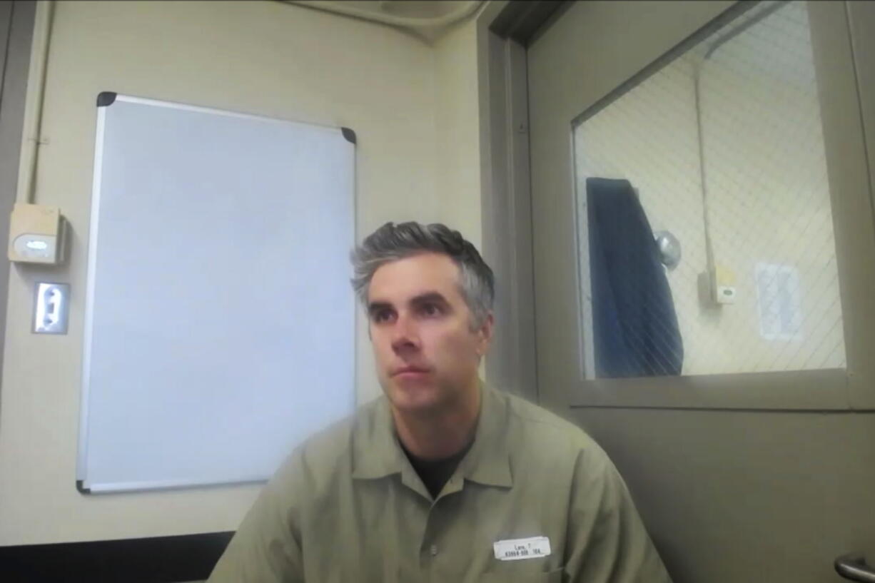 In this image from video, former Minneapolis Police Officer Thomas Lane listens Sept. 21, 2022 from Littleton, Colorado. Lane pleaded guilty to a state charge of aiding and abetting second-degree manslaughter in the killing of George Floyd. Hennepin County Judge Peter Cahill sentenced Lane to three years. Lane appeared via video from the Federal Correctional Institution Englewood, a low-security federal prison camp.