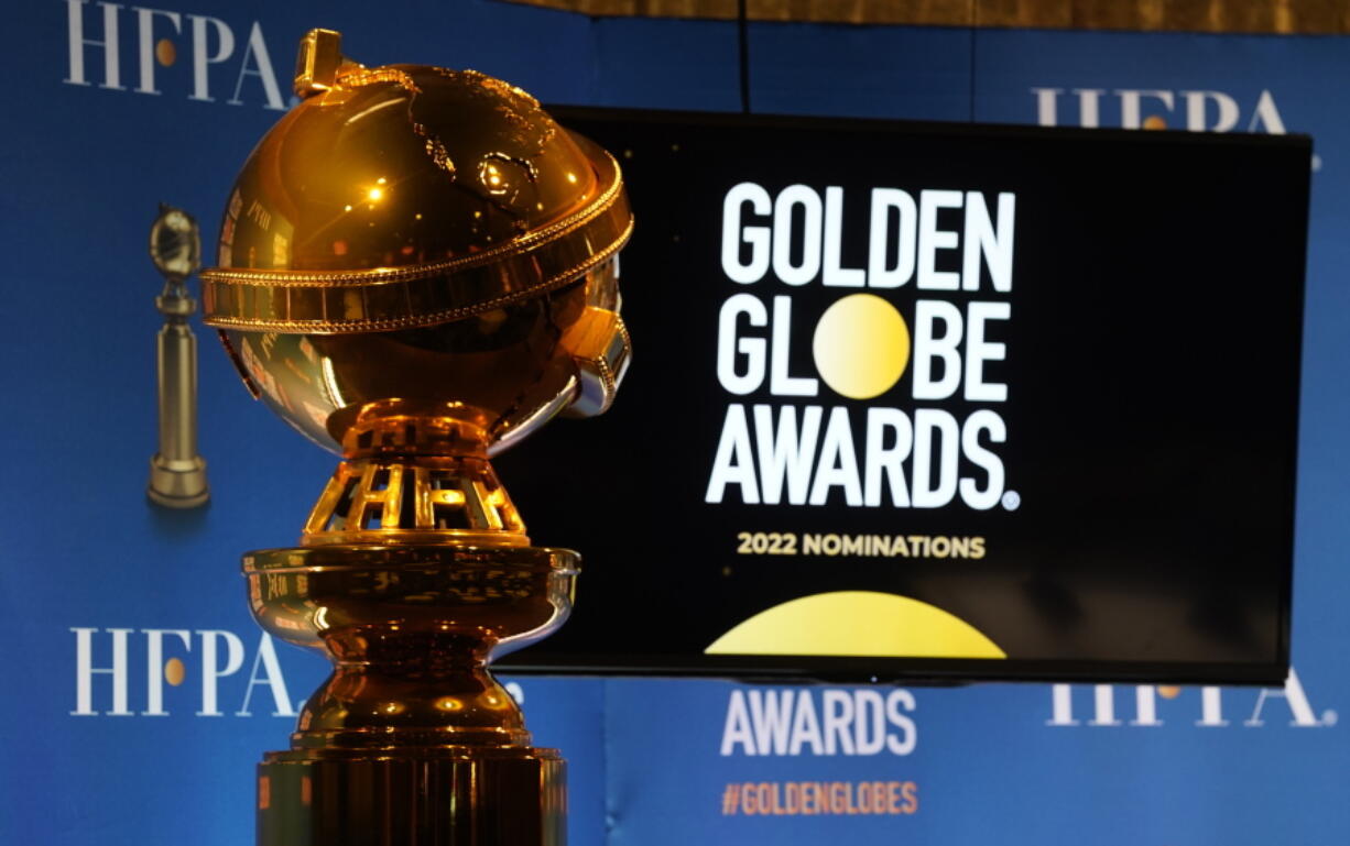 FILE - A Golden Globe statue appears at the nominations event for 79th annual Golden Globe Awards at the Beverly Hilton Hotel on Dec. 13, 2021, in Beverly Hills, Calif. After a year spent off air, the Golden Globe Awards are returning to NBC in January, NBC, the Hollywood Press Association and Dick Clark Productions announced Tuesday , Sept. 20, 2022.