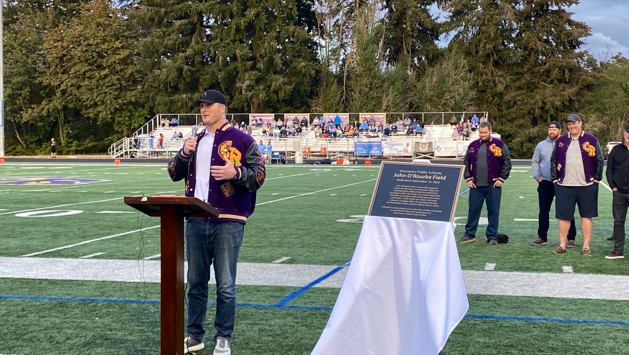 Brett Pierce, a 1999 River graduate who played football at Stanford and the NFL, addresses the crowd during Friday's pregame ceremony.