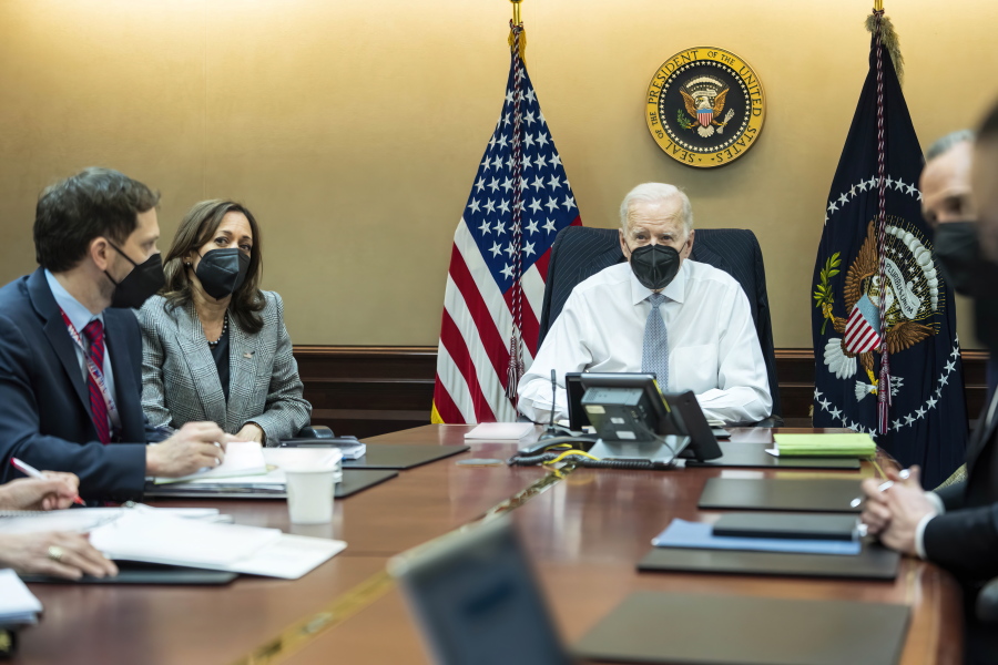 FILE - In this image provided by The White House, President Joe Biden and Vice President Kamala Harris and members of the President's national security team observe from the Situation Room at the White House in Washington, on Feb. 2, 2022, the counterterrorism operation responsible for removing from the battlefield Abu Ibrahim al-Hashimi al-Qurayshi, the leader of the Islamic State group. Biden and top national security officials have cited the recent strike killing al-Qaida head Ayman al-Zawahri as evidence that America maintains an "over-the-horizon" counterterrorism capacity in Afghanistan after the withdrawal.