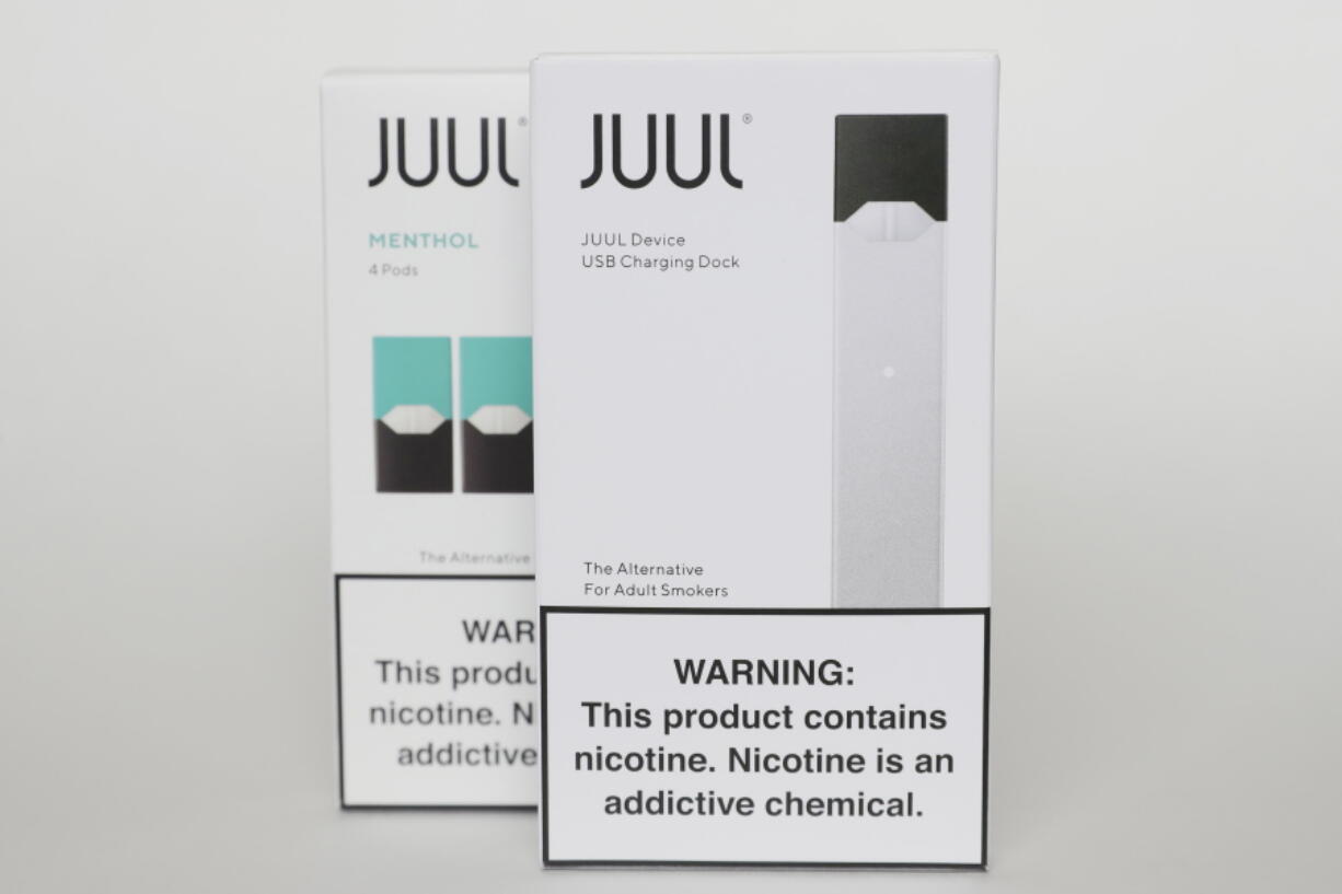 FILE - Packaging for an electronic cigarette and menthol pods from Juul Labs is displayed on Feb. 25, 2020, in Pembroke Pines, Fla. In a deal announced Tuesday, Sept. 6, 2022, electronic cigarette maker Juul Labs will pay nearly $440 million to settle a two-year investigation by 33 states into the marketing of its high-nicotine vaping products, which have long been blamed for sparking a national surge in teen vaping.