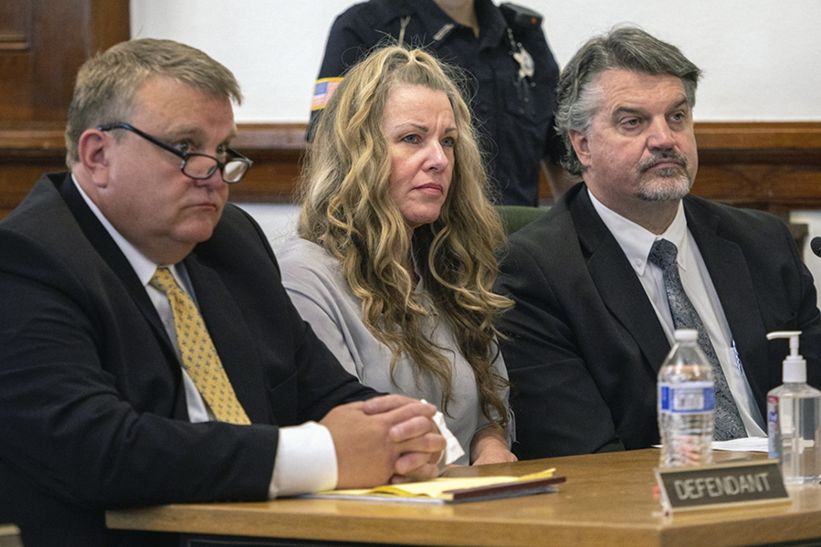 FILE - Lori Vallow Daybell sits between her attorneys for a hearing at the Fremont County Courthouse in St. Anthony, Idaho, on Aug. 16, 2022. A coalition of news organizations is asking an Idaho judge to reject a request to ban cameras from the courtroom in a high-profile triple murder case. The request, led by EastIdahoNews.com and joined by 32 news organizations including The Associated Press, was filed Thursday, Sept.