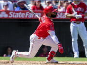 Los Angeles Angels' Luis Rengifo watches his two-run home run, his second of the game, against the Seattle Mariners during the third inning of a baseball game in Anaheim, Calif., Sunday, Sept. 18, 2022.