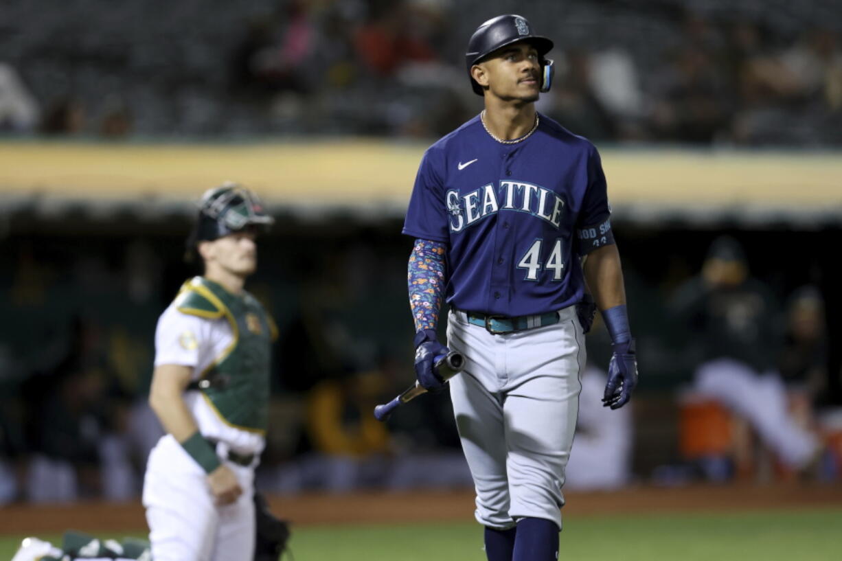 Seattle Mariners' Julio Rodriguez (44) walks back to the dugout after striking out against the Oakland Athletics during the fifth inning of a baseball game in Oakland, Calif., Tuesday, Sept. 20, 2022.