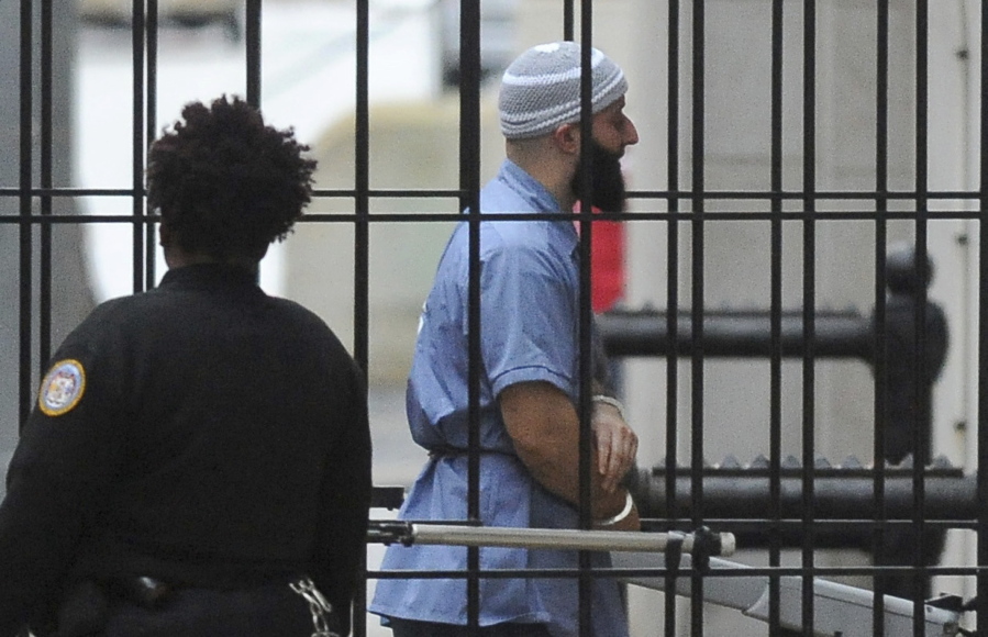 FILE - Adnan Syed enters Courthouse East prior to a hearing on Feb. 3, 2016, in Baltimore. A court hearing has been set for Monday, Sept.