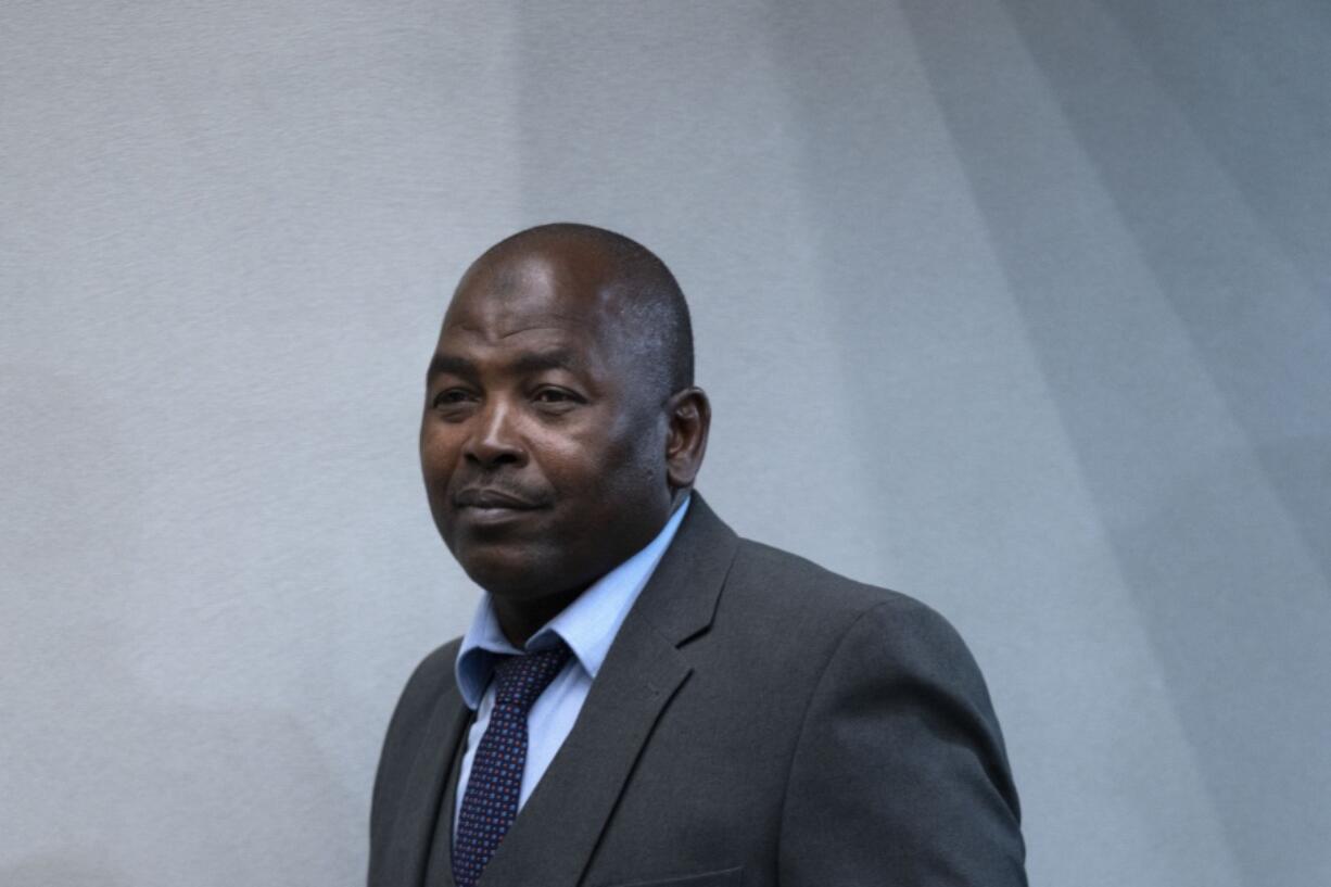 Mahamat Said Abdel Kani enters the court room of the International Criminal Court in The Hague, Netherlands, Monday, Sept. 26, 2022. The trial of an alleged commander in a mainly Muslim rebel group from Central African Republic opened and charged Said with crimes against humanity and war crimes.