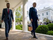 President Joe Biden walks to the Oval Office with National Economic Council director Brian Deese, left, after speaking about a tentative railway labor agreement in the Rose Garden of the White House, Thursday, Sept. 15, 2022, in Washington.