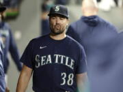 Seattle Mariners starting pitcher Robbie Raywals walks through the dugout after he was pulled from the game during the sixth inning of a baseball game against the Texas Rangers, Tuesday, Sept. 27, 2022, in Seattle.