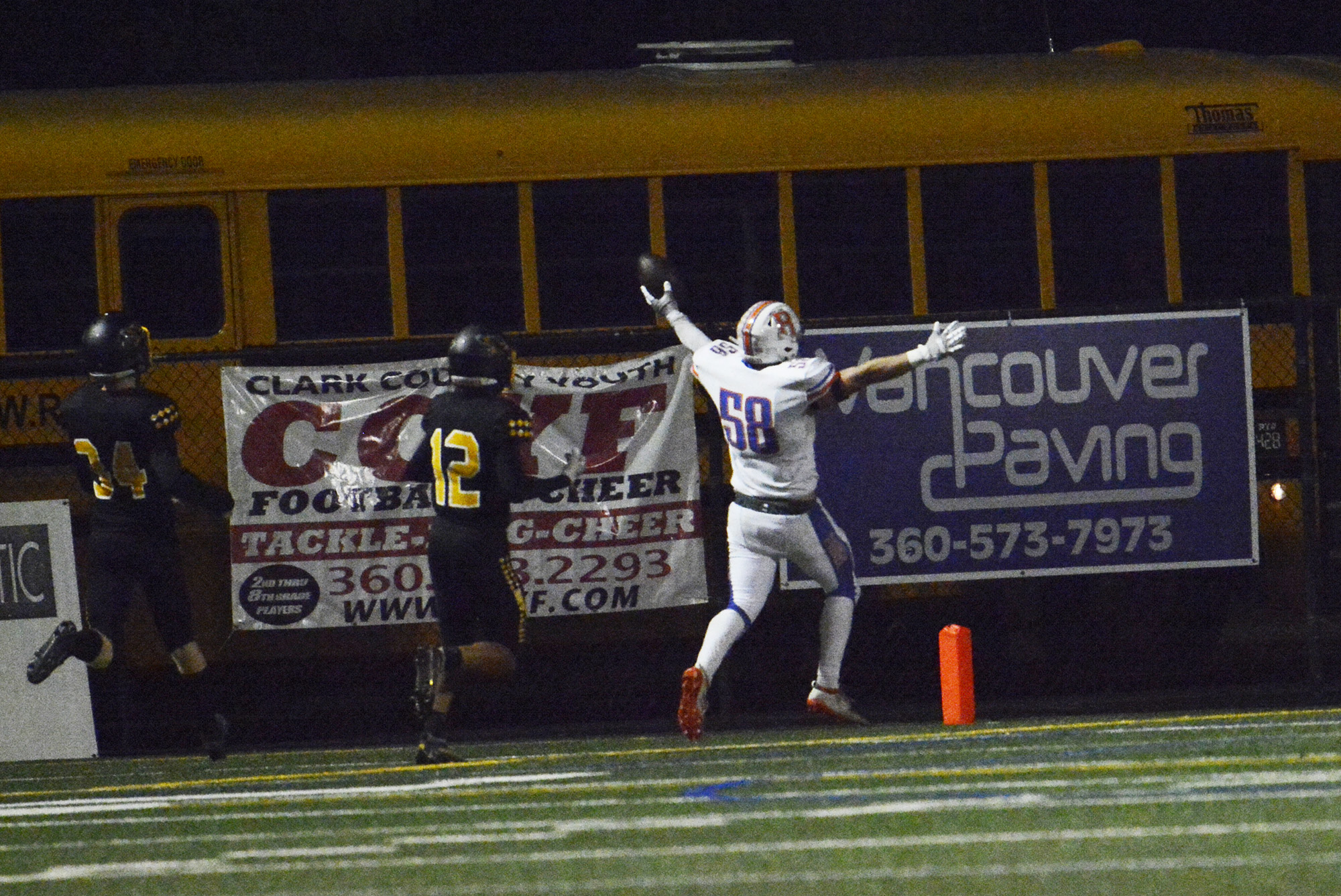 Ridgefield’s Wyatt Bartroff celebrates after returning a blocked punt 86 yards for a touchdown in the first half of a 2A Greater St. Helens League football game at Kiggins Bowl on Thursday, Sept. 22, 2022.