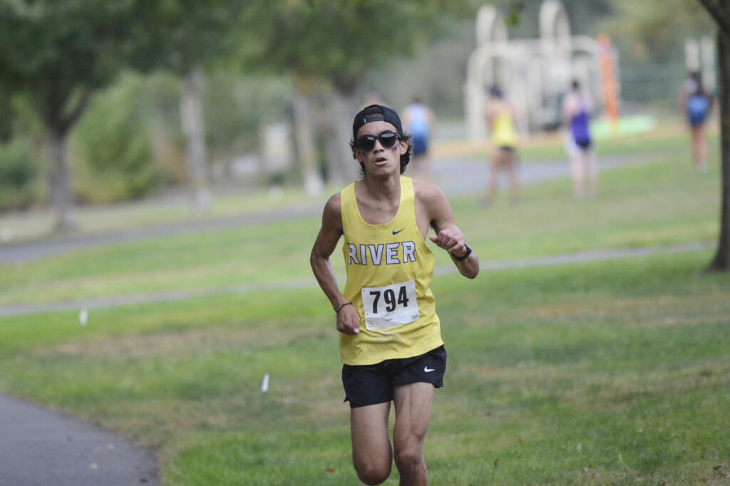 Columbia River’s Neftali Menendez leads the boys race at a three-team cross country meet at Vancouver Lake Park on Wednesday, Sept. 21, 2022.