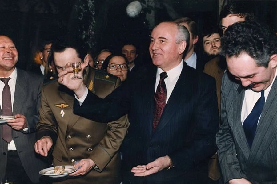 Soviet Union President Mikhail Gorbachev toasts with a small glass of lemon-flavored vodka at a going-away party for his staff on Dec. 26, 1991, the day after his nationally televised address in which he announced his resignation as president, in Moscow. Associated Press correspondent Brian Friedman is back right of Gorbachev.