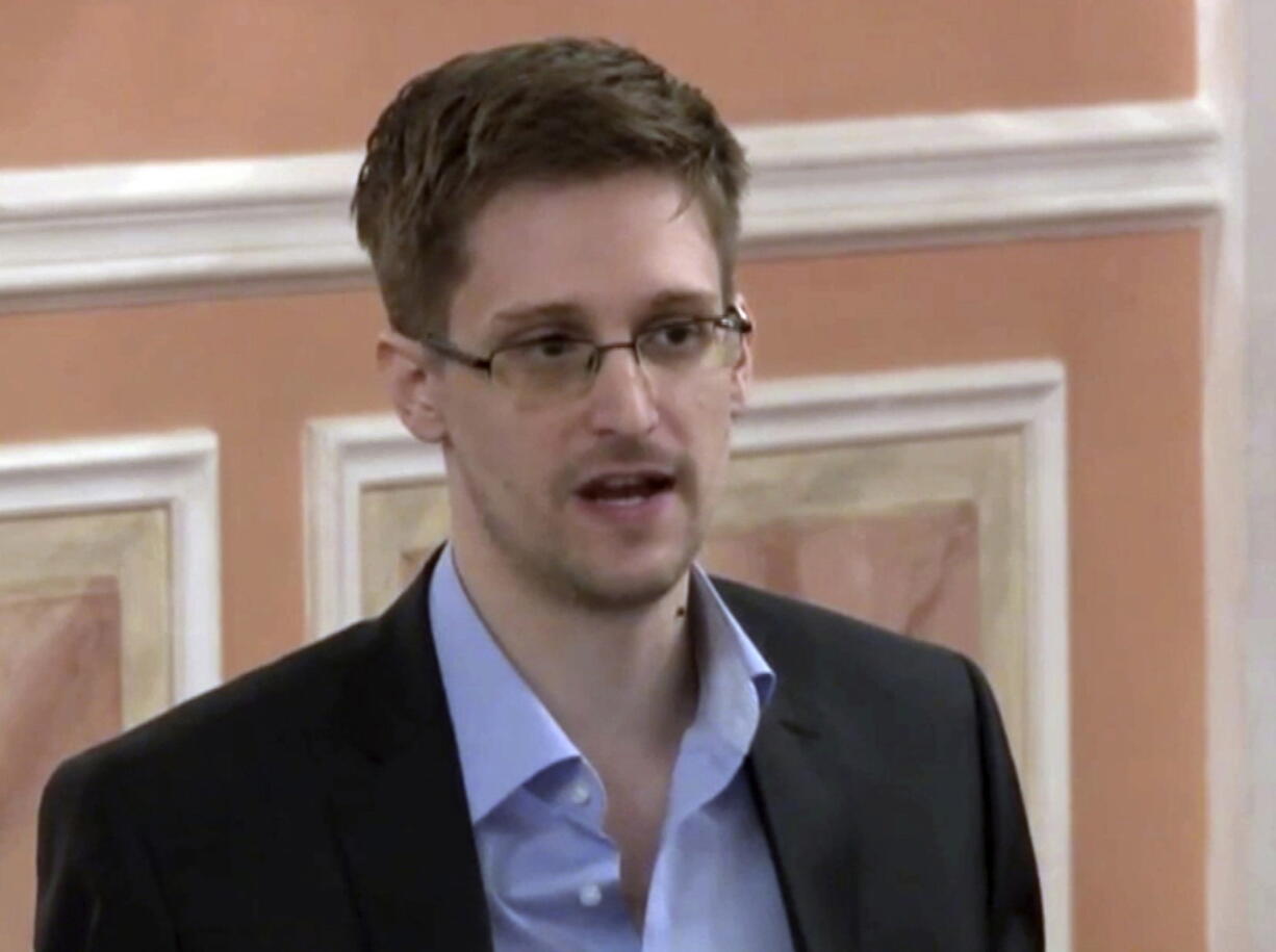 FILE - In this image made from video and released by WikiLeaks, former National Security Agency systems analyst Edward Snowden speaks in Moscow, Oct. 11, 2013. President Vladimir Putin has granted Russian citizenship to former U.S. security contractor Edward Snowden, according to a decree signed by the Russian leader on Monday Sept. 26, 2022.