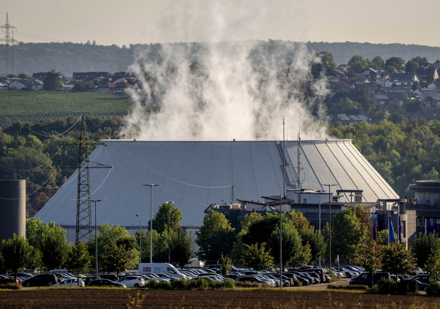 FILE - Smoke rises from the nuclear power plant of Nerckarwestheim in Neckarwestheim, Germany, on Aug. 22, 2022. Europe is staring an energy crisis in the face. The cause: Russia throttling back supplies of natural gas. European officials say it's a pressure game over their support for Ukraine after Russia's invasion.