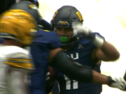 Union High School graduate Alishawuan Taylor celebrates with his Northern Arizona teammates after his first collegiate touchdown on Saturday against Idaho.