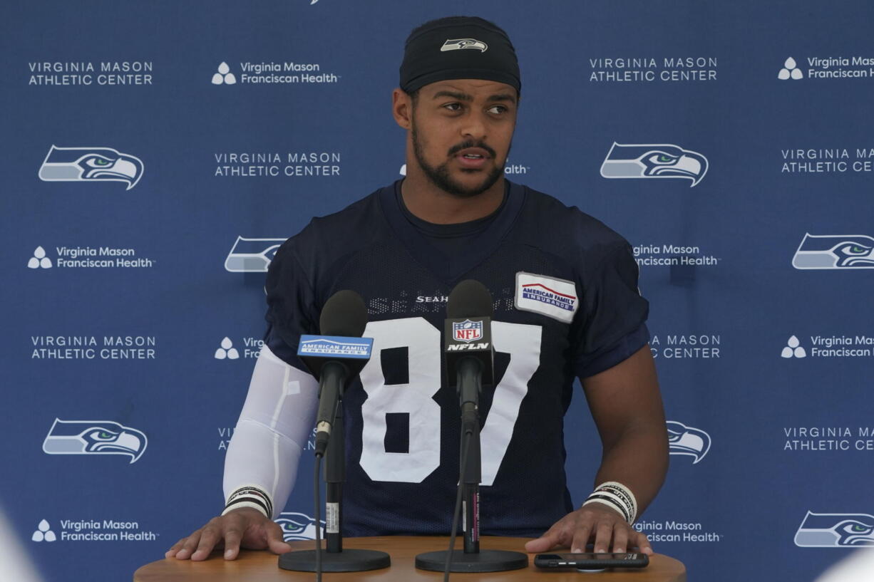 FILE - Seattle Seahawks tight end Noah Fant talks to reporters after NFL football practice Thursday, July 28, 2022, in Renton, Wash. New Seattle defensive tackle Shelby Harris and tight end Noah Fant are about to face their old team when the Denver Broncos come visiting to open the season. (AP Photo/Ted S.