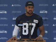 FILE - Seattle Seahawks tight end Noah Fant talks to reporters after NFL football practice Thursday, July 28, 2022, in Renton, Wash. New Seattle defensive tackle Shelby Harris and tight end Noah Fant are about to face their old team when the Denver Broncos come visiting to open the season. (AP Photo/Ted S.