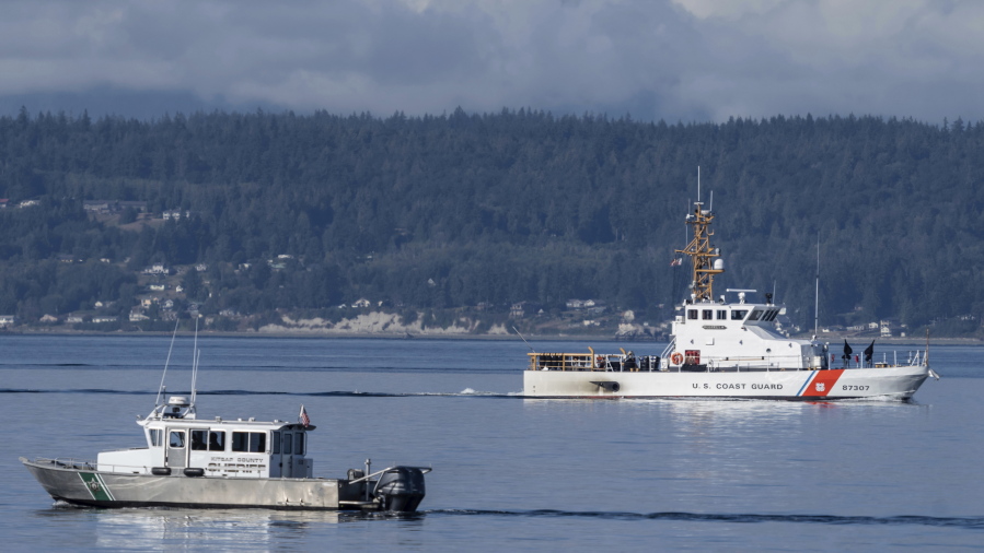 FILE - A U.S. Coast Guard boat and Kitsap, Wash., County Sheriff boat search the area, Monday, Sept. 5, 2022, near Freeland, Wash., on Whidbey Island north of Seattle where a chartered floatplane crashed the day before, killing 10 people. Crews later this month will begin trying to recover the wreckage. rews later this month will begin trying to recover the wreckage of a seaplane that crashed in Puget Sound off Whidbey Island in Washington state. The National Transportation Board said Friday, Sept. 16, 2022 it will work with the Navy to collect the wreckage of the DHC-3 Turbine Otter.