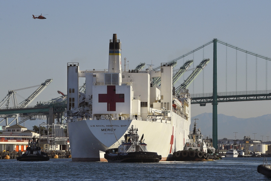 FILE - The USNS Mercy hospital ship enters the Port of Los Angeles, March 27, 2020. The Solomon Islands government on Wednesday, Aug. 31, 2022, asked countries to not send naval vessels to the South Pacific nation until approval processes are overhauled. The U.S. Navy hospital ship USNS Mercy is currently in Honiara. (AP Photo/Mark J.