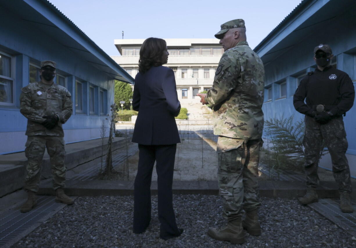 U.S. Vice President Kamala Harris, center left, stands next to the demarcation line at the demilitarized zone (DMZ) separating the two Koreas, in Panmunjom, South Korea Thursday, Sept. 29, 2022.
