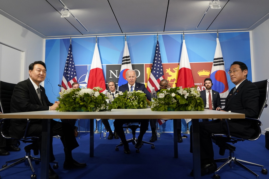 FILE - President Joe Biden, center, meets with South Korea's President Yoon Suk Yeol, left, and Japan's Prime Minister Fumio Kishida during the NATO summit in Madrid, on June 29, 2022. The leaders of South Korea and Japan will meet next week on the sidelines of the U.N. General Assembly in New York, Seoul officials said Thursday, Sept.