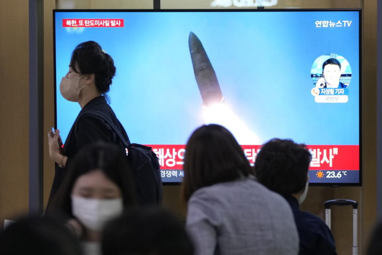 FILE - A TV screen shows a file image of a North Korean missile launch during a news program at the Seoul Railway Station in Seoul, South Korea, Wednesday, Sept. 28, 2022. South Korea says late Thursday, Sept. 29, 2022, that North Korea has fired another missile toward its eastern waters, in the third round of launches this week.