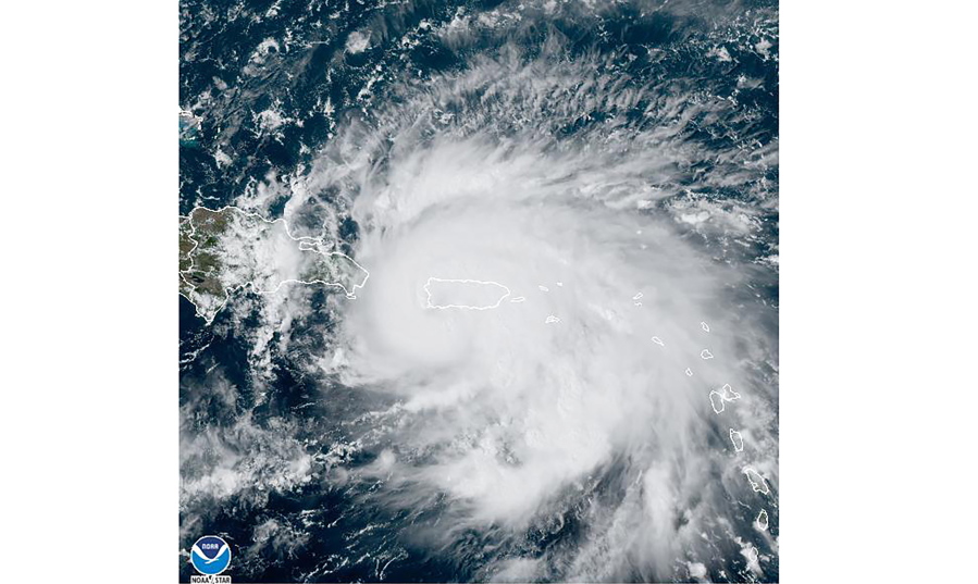 This satellite image provided by NOAA shows Hurricane Fiona in the Caribbean on Sunday, Sept. 18, 2022. The eye of newly formed Hurricane Fiona is near the coast of Puerto Rico -- and it has already sparked an island-wide blackout and threatens to dump "historic" levels of rain.