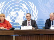 Erik Mose, center, Chair of the Commission of Inquiry on Ukraine, Jasminka Dzumhur, left, and Pablo de Greiff, right, Commissioners of Inquiry on Ukraine, talk to the media during a press conference following an update to the UN Human Rights Council, at the European headquarters of the United Nations in Geneva, Switzerland, Friday, Sept. 23, 2022. A team of experts commissioned by the U.N.'s top human rights body to look into rights violations in Ukraine said Friday its initial investigation turned up evidence of war crimes in the country following Russia's invasion nearly seven months ago.