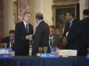 Secretary of State Antony Blinken, left, greets dignitaries from Pacific Island Countries during the U.S.-Pacific Island Country Summit at the State Department in Washington on Wednesday, Sept. 28, 2022.