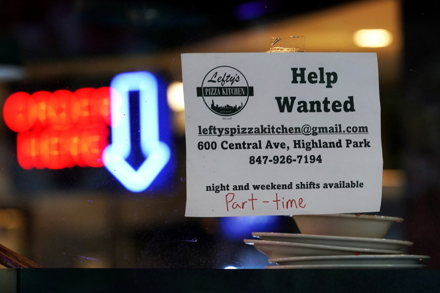 FILE - Hiring sign is displayed at a restaurant in Highland Park, Ill., Thursday, July 14, 2022. Fewer Americans filed for unemployment benefits last week as the labor market continues to shine despite weakening elements of the U.S. economy. Applications for jobless aid for the week ending Aug. 27, fell by 5,000 to 232,000, the Labor Department reported Thursday, Sept. 1.  (AP Photo/Nam Y.