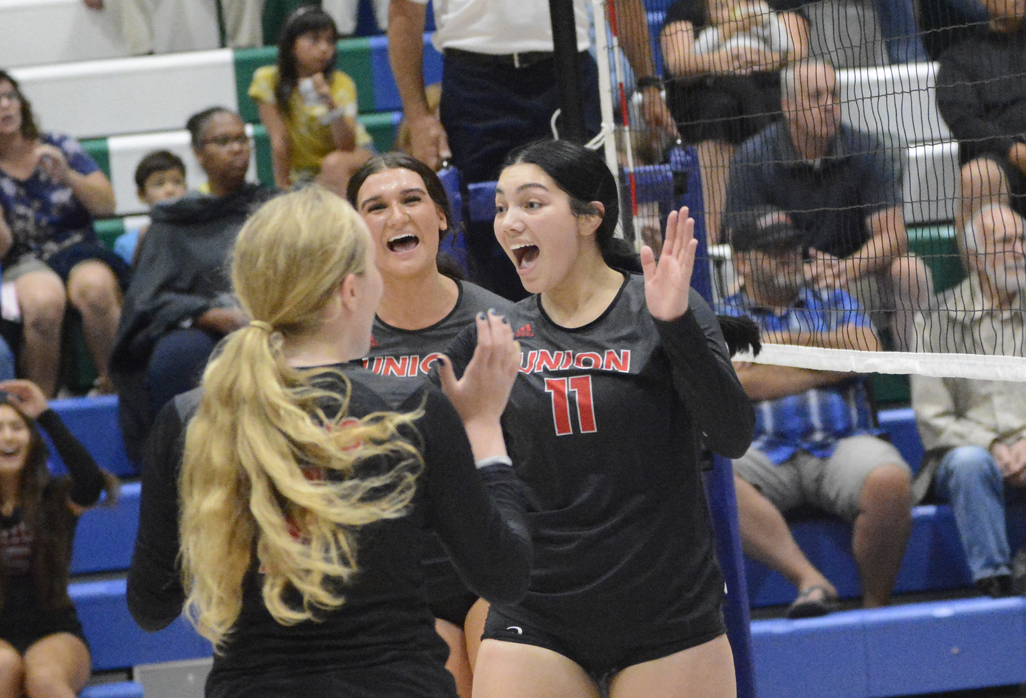 Union’s Ruby Ochoa (11) celebrates a point with her teammates during the Titans’ match at Mountain View on Thursday, Sept. 8, 2022.