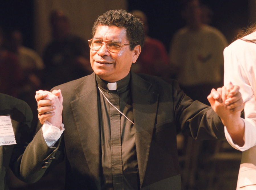 FILE - Bishop Carlos Ximenes Belo of East Timor, sings along with participants at the National Catholic Gathering for Jubilee Justice held on the UCLA Campus in Los Angeles, on July 17, 1999. Belo has been accused in a Dutch magazine article of sexually abusing boys in East Timor in the 1990s, rocking the Catholic Church in the impoverished nation and forcing officials at the Vatican and his religious order to scramble to provide answers.