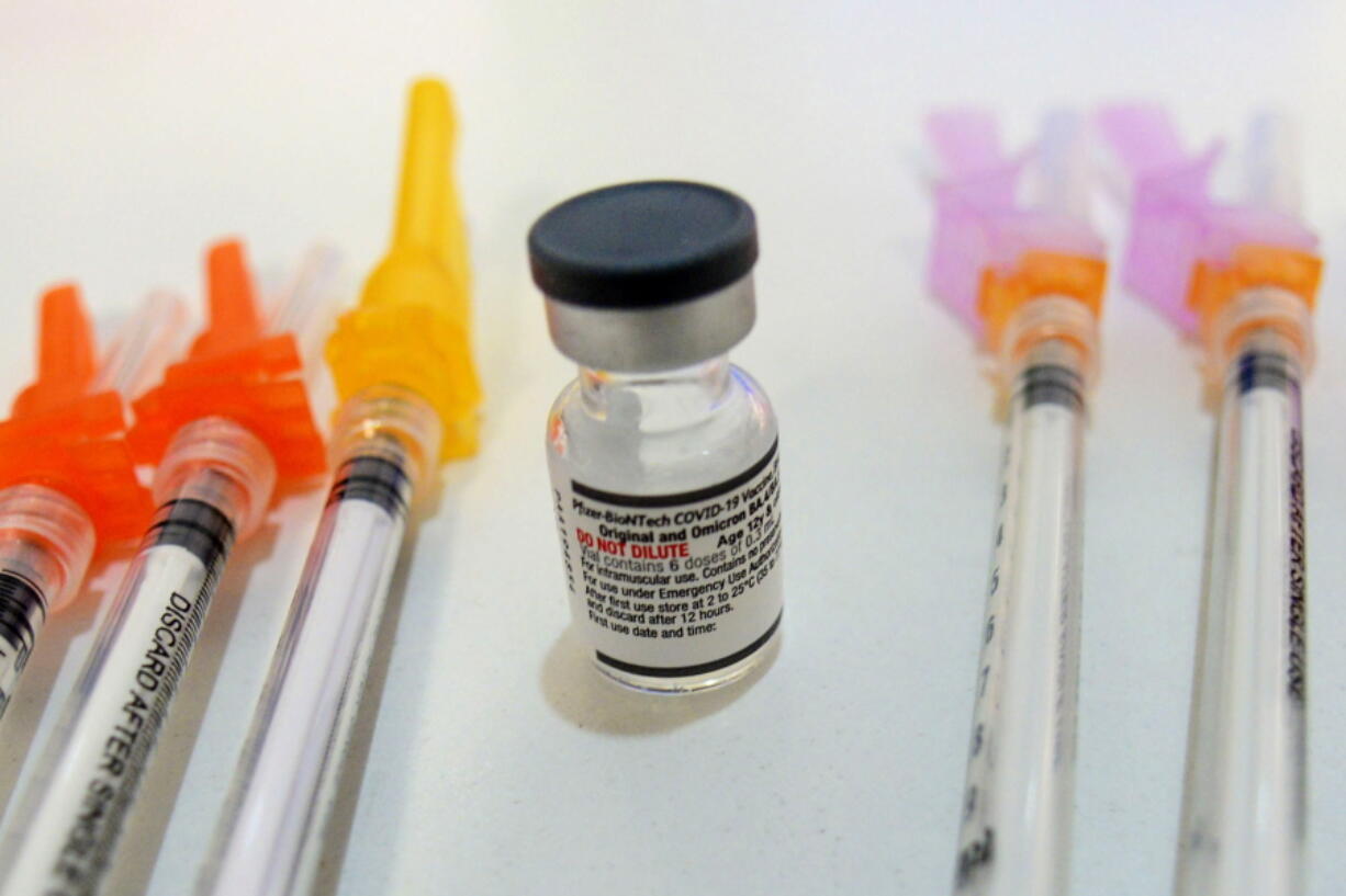 FILE - Booster shots of the Pfizer COVID-19 vaccine are displayed during a vaccine clinic in Townshend, Vt., on Tuesday, Sept. 20, 2022. U.S. health officials say 4.4 million Americans have rolled up their sleeves for the updated COVID-19 booster shot.