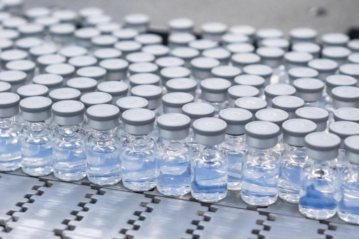 This August 2022 photo provided by Pfizer shows vials of the company's updated COVID-19 vaccine during production in Kalamazoo, Mich.