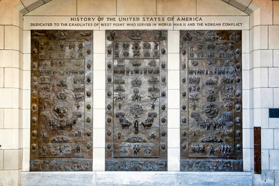 This photo provided by the U.S. Military Academy at West Point, in New York, shows the three bronze panels at one of the entrances to Bartlett Hall, at West Point, that depicts the history of the United States. A commission created by Congress is recommending that multiple historical reminders tied to Confederate officers during the Civil War be removed -- many honoring Robert E. Lee, one of the academy's most famous graduates. (U.S.