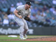 Chicago White Sox closing pitcher Liam Hendriks reacts after striking out Seattle Mariners' Adam Frazier to end the baseball game Wednesday, Sept. 7, 2022, in Seattle. The White Sox won 9-6.
