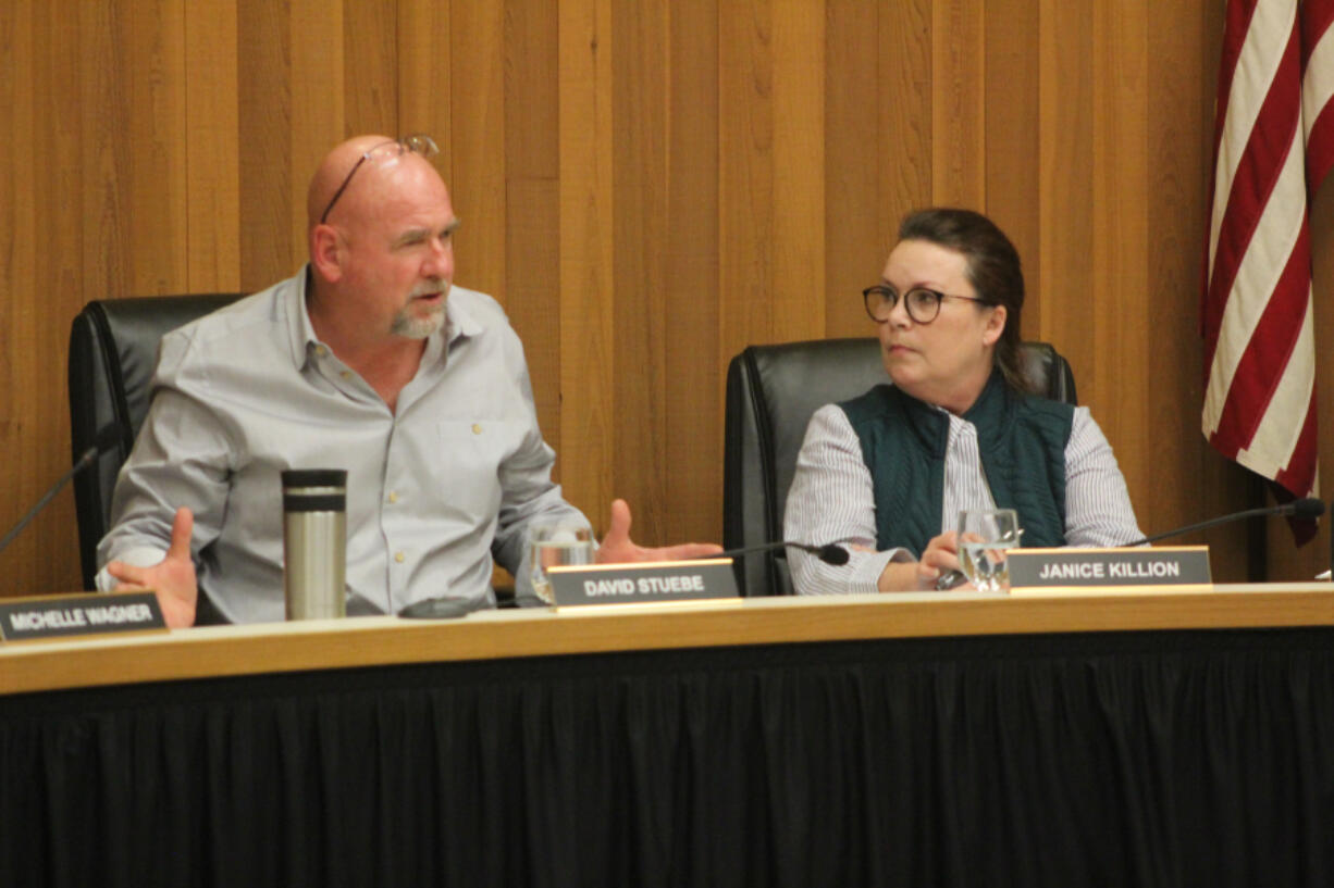 Washougal City Councilmember David Stuebe, left, speaks as Councilmember Janice Killion looks on during a Washougal City Council meeting at Washougal City Hall in March 2022. Stuebe was sworn in Sept. 26 as Washougal's new mayor.
