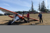 The pilot of a small, Cessna-type plane walked away uninjured after making an emergency landing Thursday afternoon in a field in Ridgefield.