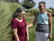 Breast cancer survivors Jaron Farley, right, and Brenda Fletcher Gaston chose different paths after mastectomy. Farley had implants that had to be removed nine years later; then she underwent DIEP flap reconstruction. Gaston decided to go flat.