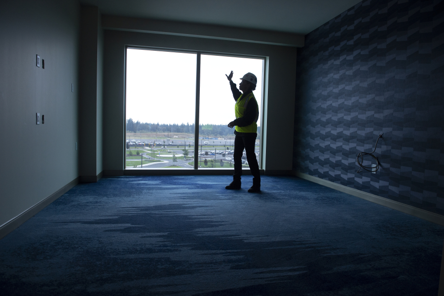 Kara Fox-LaRose, president and general manager of ilani, checks out the view from a fifth-floor hotel guest room near La Center. The hotel is expected to open by May 2023.