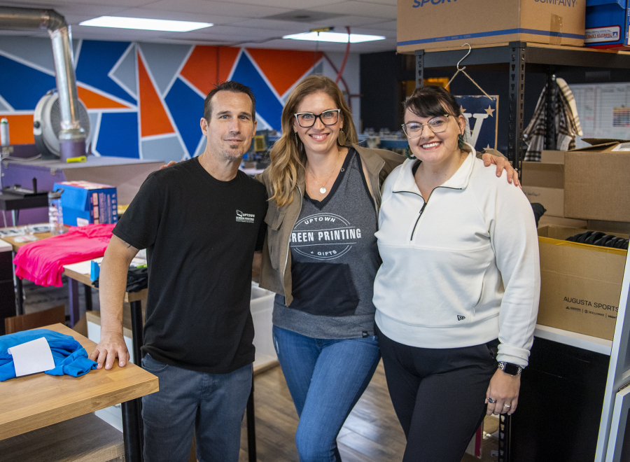 Production manager Dan Roberts, from left, owner Jamie Young and sales assistant Krystin Alexander are all part of the team that makes up Uptown Screen Printing.