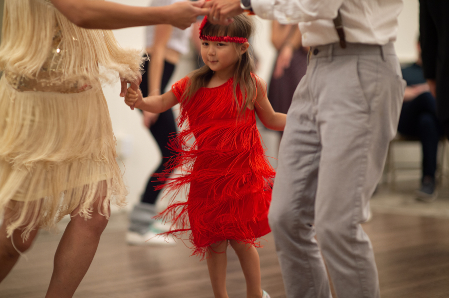 Five-year-old flapper girl Sana Teo dances with her parents, Hiro and Alan.