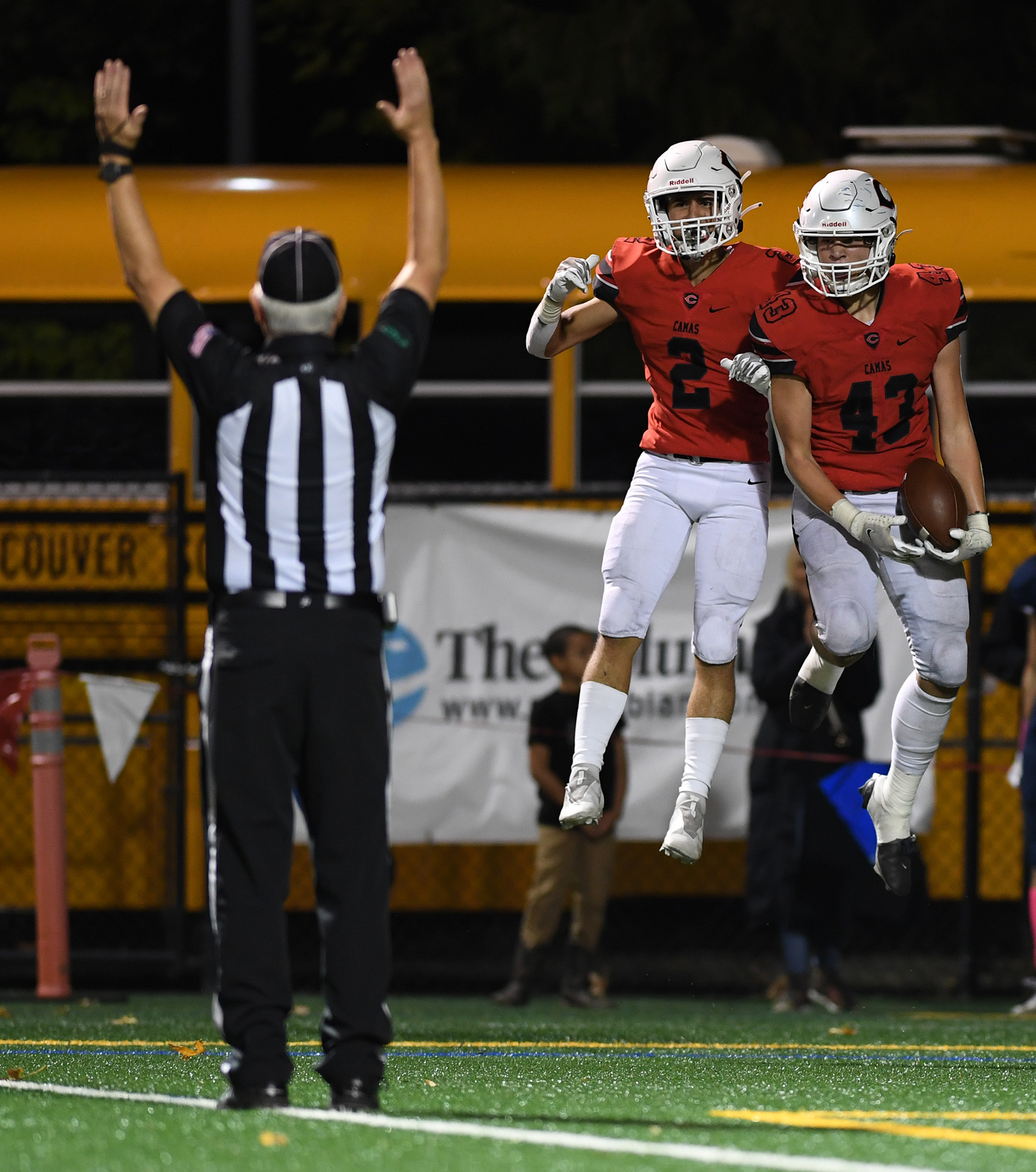 Camas senior Zach Blair, left, and sophomore Nikko Speer celebrate after a touchdown Friday, Oct. 14, 2022, during the Papermakers’ 36-33 win against Skyview at Kiggins Bowl.